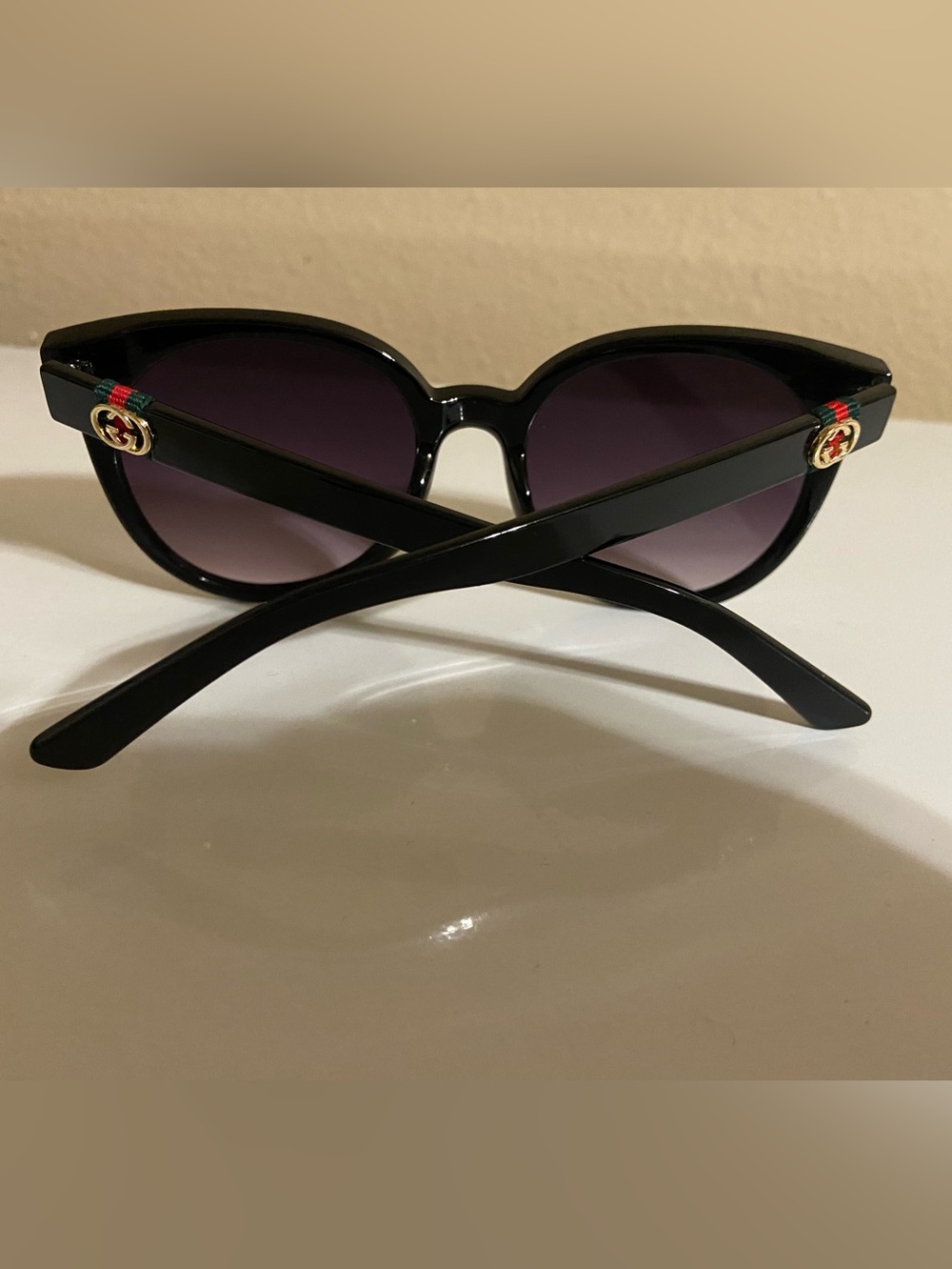 Gucci Black Sunglasses with Purple Gradient Lenses and Gold Accent
